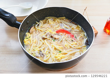 Hot and sour noodles made in a frying pan 129546221