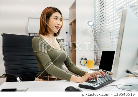 Happy woman working online from home office, lifestyle and small business. Happy woman working online from home office, lifestyle and small business. 129546519