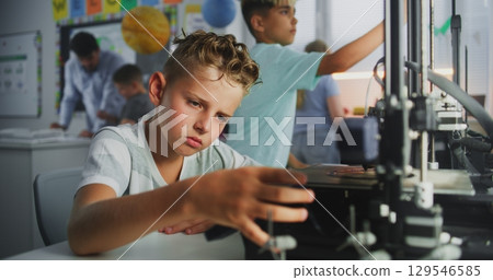 Smart Young Boy Using 3D Printer Control Panel, Learning Advanced Automated 3D Printing 129546585
