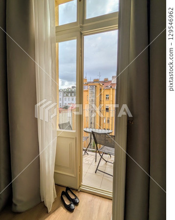 Cityscapes viewed from a European apartment balcony | Window life and serene scenery 129546962