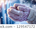 Gloves and snow (AI-generated image) 129547172