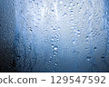 Condensation and frost on a winter window (AI-generated image) 129547592