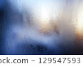 Condensation and frost on a winter window (AI-generated image) 129547593