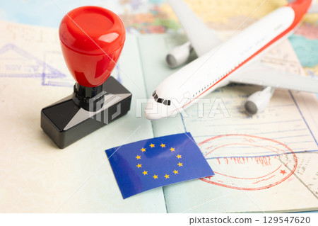 Eu country passport with approved stamp on document for tourism to immigration at airport in country. Eu country passport with approved stamp on document for tourism to immigration at airport in country. 129547620