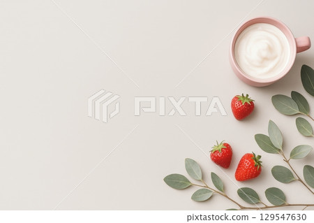 White background with a pink cup and strawberries 129547630