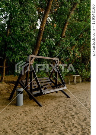Large wooden swing on the beach 129548160