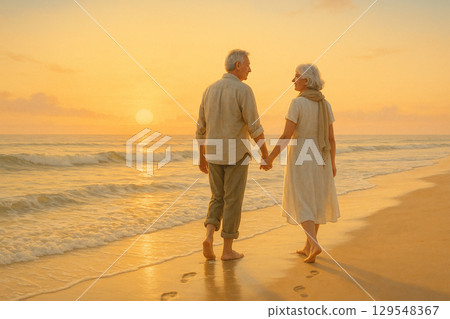 Senior couple walking along the shore 129548367