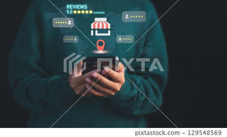 Female customer using a smartphone to check local business reviews and ratings, with location and star feedback icons. Digital marketing, local SEO, and consumer experience in online business reviews. Female customer using a smartphone to check local business reviews and ratings, with location and star feedback icons. Digital marketing, local SEO, and consumer experience in online business reviews. 129548569