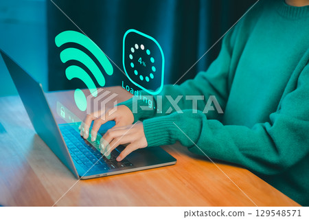 Person typing on a laptop with glowing Wi-Fi and loading graphics, symbolizing internet connectivity, online access, download digital business data form website, and slow data transfer progress. Person typing on a laptop with glowing Wi-Fi and loading graphics, symbolizing internet connectivity, online access, download digital business data form website, and slow data transfer progress. 129548571