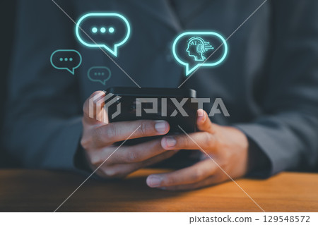 Person using a smartphone with technology smart robot AI chatbot for chat. digital chatbot are assistant conversation for provide access to data growth of business in online network. Person using a smartphone with technology smart robot AI chatbot for chat. digital chatbot are assistant conversation for provide access to data growth of business in online network. 129548572