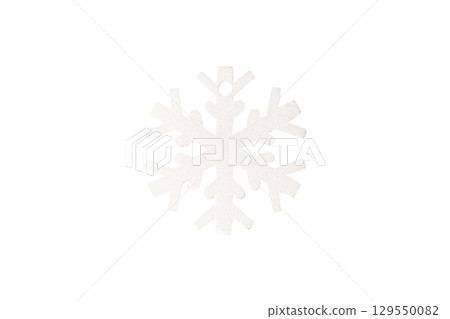White wooden snowflake isolated on white background. White wooden snowflake isolated on white background. 129550082
