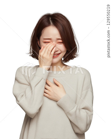 Portrait of a young Japanese woman crying and showing emotional expression, unable to hold back tears 129550219