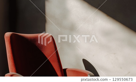 Minimalist view of theater chairs in warm neutral tones 129550673