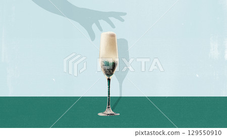 Collage of sparkling champagne glass with hand shadow on minimalist background Collage of sparkling champagne glass with hand shadow on minimalist background 129550910