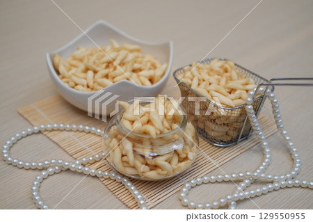 Crispy Fried Snack in Glass Jar and Basket Crispy Fried Snack in Glass Jar and Basket 129550955