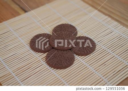 Chocolate Biscuits on Bamboo Mat 129551036