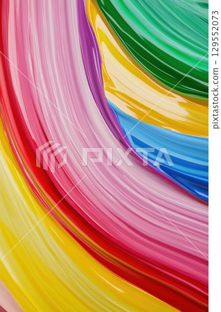Vibrant abstract artwork with swirling paint strokes blending red, pink, yellow, green, and blue into dynamic, fluid composition expressing energetic color interaction 129552073