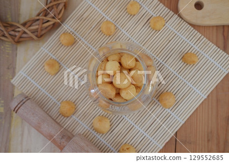 Round Cheese Biscuits on Bamboo Mat 129552685
