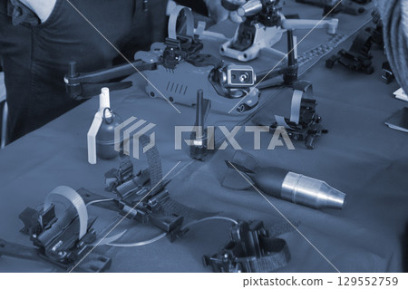 Bomb. Bomb model for drone. Model of bomb printed on 3D printer from melted plastic. Body of bomb with tail created on 3D printer. Prototype of ammunition printed on 3D printer. Innovation 3d printing 129552759