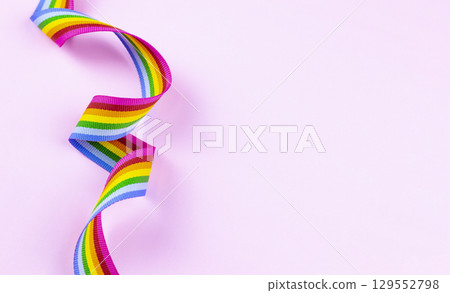 2. LGBTQ Rainbow Ribbon on Bright Pink Background 2. LGBTQ Rainbow Ribbon on Bright Pink Background 129552798