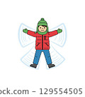 Child making a snow angel in winter clothing 129554505