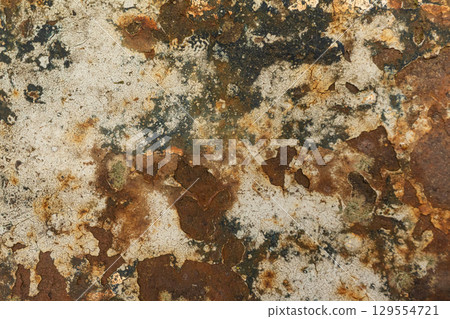 Rustic corroded metal texture with brown and orange patina 129554721
