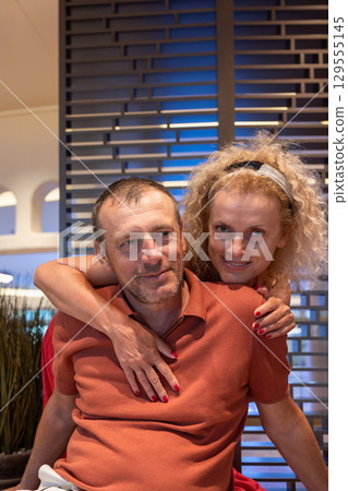 Couple in love on cruise ship. Man and woman in love enjoying their romantic vacation. Vertical photo. High quality photo 129555145