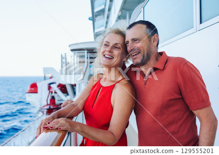 Couple in love on cruise ship. Man and woman in love enjoying their romantic vacation. High quality photo Couple in love on cruise ship. Man and woman in love enjoying their romantic vacation. High quality photo 129555201