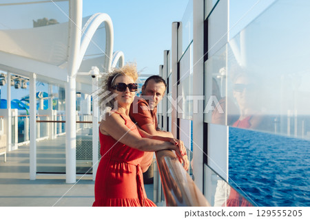Married couple on cruise ship. Attractive couple on deck with cruise ship. High quality photo Married couple on cruise ship. Attractive couple on deck with cruise ship. High quality photo 129555205