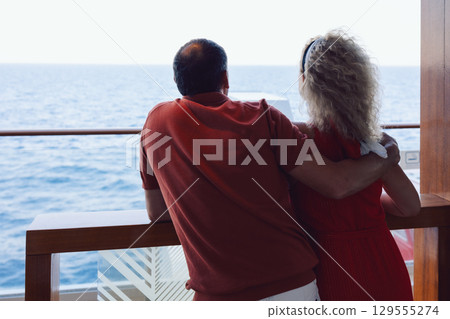 Couple in love on cruise ship. Man and woman in love enjoying their romantic vacation. High quality photo Couple in love on cruise ship. Man and woman in love enjoying their romantic vacation. High quality photo 129555274