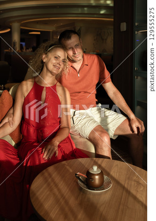 Couple in love on cruise ship. Man and woman in love enjoying their romantic vacation. Vertical photo. High quality photo Couple in love on cruise ship. Man and woman in love enjoying their romantic vacation. Vertical photo. High quality photo 129555275