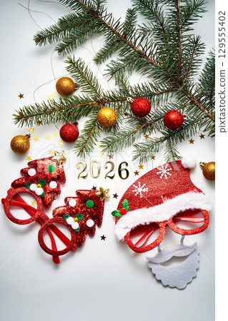 Abstract background of Christmas attributes with the year number 2026. 129555402