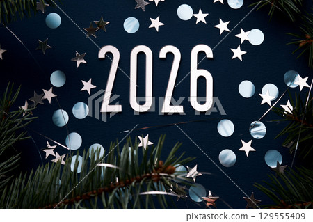 New Year 2026 blue background. Number of the coming year in Christmas decoration. 129555409