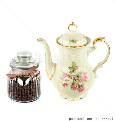 Elegant vintage porcelain coffee pot isolated on white background. Elegant vintage porcelain coffee pot isolated on white background. 129556441
