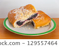 Bun filled with berries known in Poland as Jagodzianka. 129557464