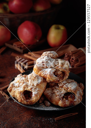 Homemade mini apple strudels with apples and cinnamon. 129557527