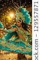 Vibrant carnival dancer celebrating with joyful spins under golden confetti 129557871