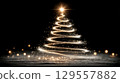 Glowing christmas tree spiral with festive lights and sparkling effects 129557882