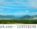 The plane is approaching the Geneva airport for landing. 129558248