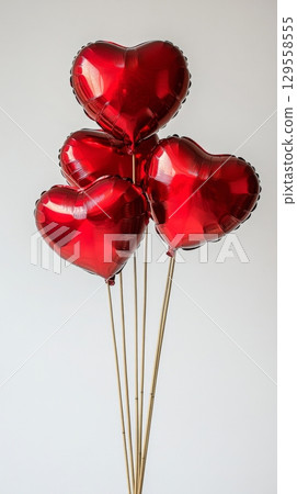 Heart-shaped Balloons in Vibrant Red Create a Festive Atmosphere for Celebrations or Events Heart-shaped Balloons in Vibrant Red Create a Festive Atmosphere for Celebrations or Events 129558555