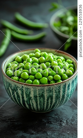 Fresh Green Peas on a Bed of Fluffy White Rice in an Earthy Bowl at a Rustic Dining Table. Fresh Green Peas on a Bed of Fluffy White Rice in an Earthy Bowl at a Rustic Dining Table. 129558936