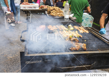 Street food, Meat on a barbecue grill  129559239