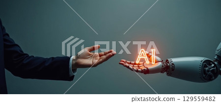 Robot and human hands engaged in a symbolic exchange of artificial intelligence concepts in a modern setting 129559482