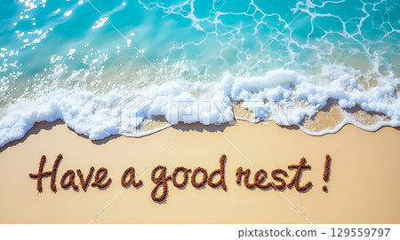 Beach message written in sand near ocean waves encourages relaxation at a tropical shore 129559797