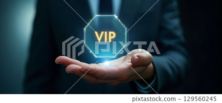 VIP access sign displayed in a business setting with a man presenting it in hand 129560245
