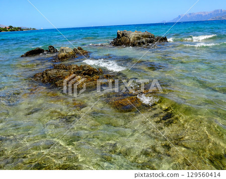 tropical sea and beach with blue sky background 129560414