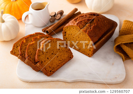Pumpkin bread freshly baked sliced on a serving board, Thanksgiving dessert 129560707