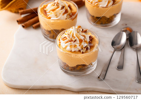Pumpkin dessert in a cup, pudding or no bake cheesecake with spices and whipped cream Pumpkin dessert in a cup, pudding or no bake cheesecake with spices and whipped cream 129560717
