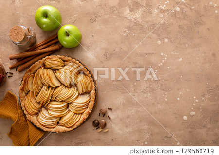 French apple pie or tart with apple slices arranged on top French apple pie or tart with apple slices arranged on top 129560719