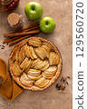 French apple pie or tart with apple slices arranged on top 129560720